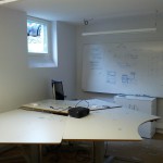 An office desk covered in broken glass after a break-in.